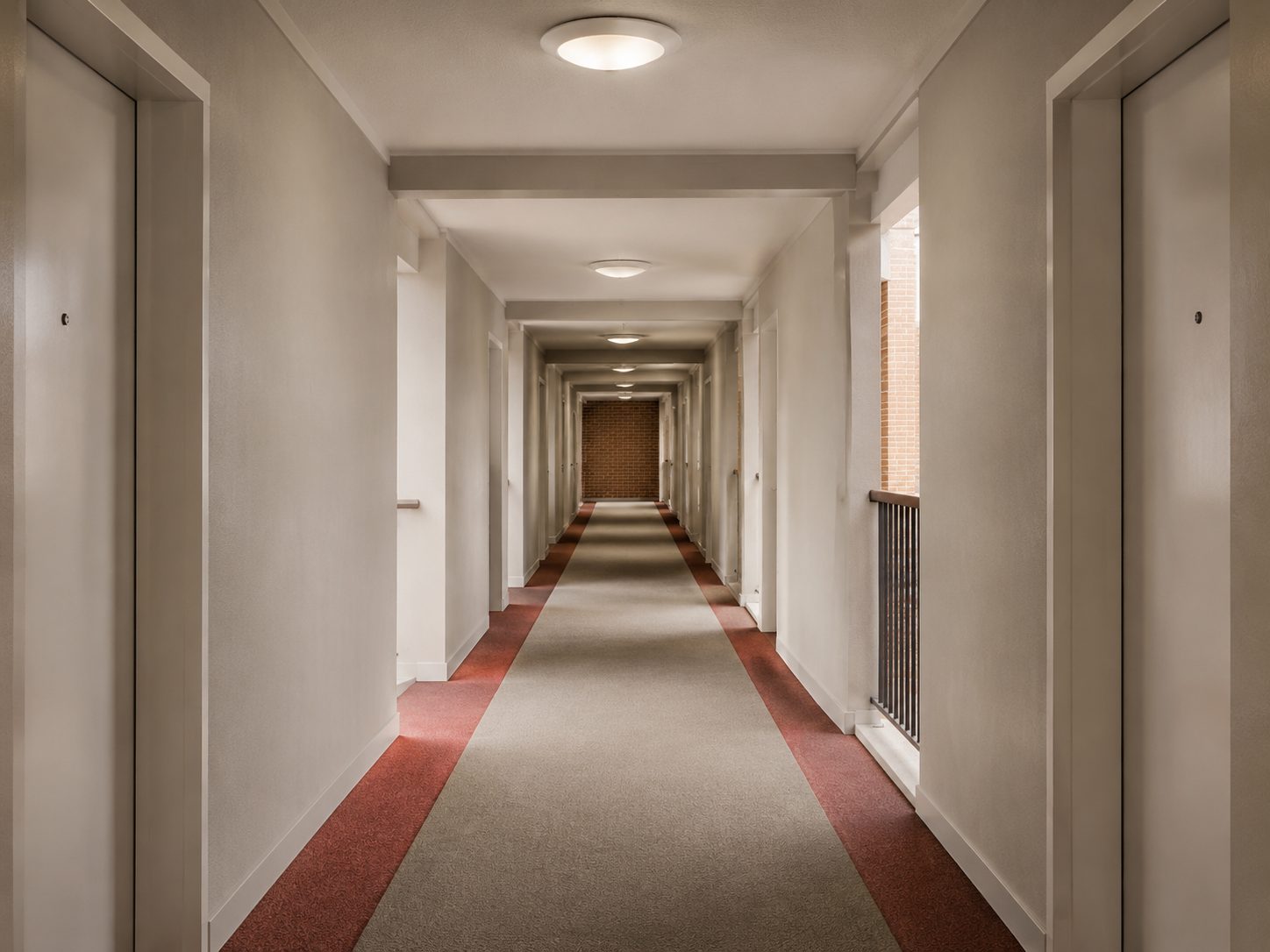 A long communal corridor in an apartment block