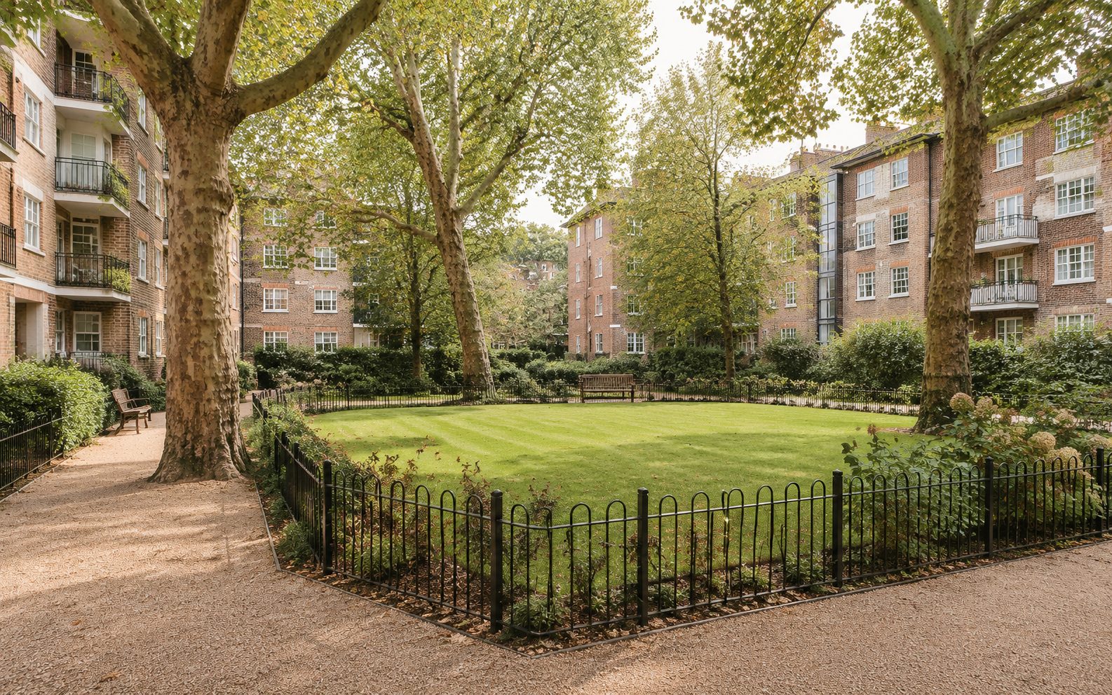 A communal garden square shared by apartment blocks